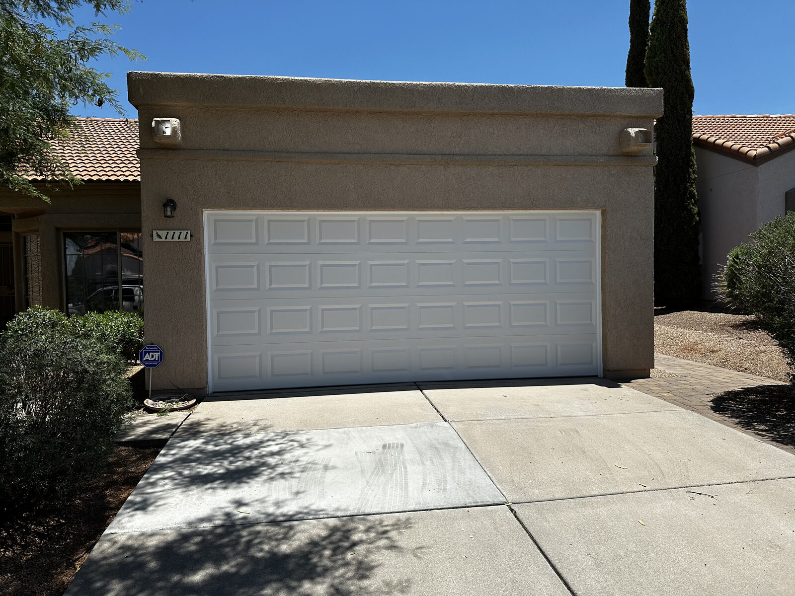 New torsion springs installed above a residential garage door