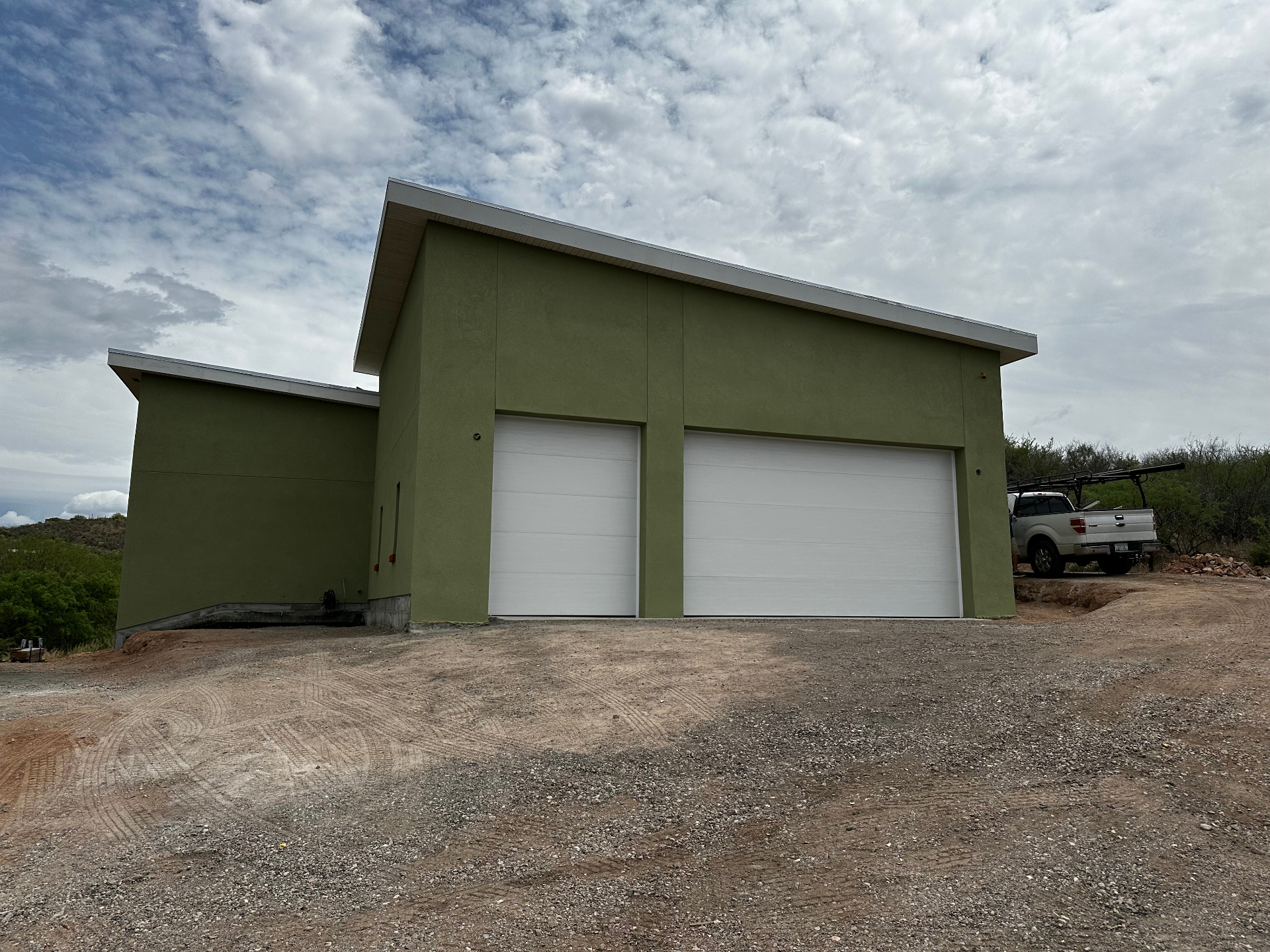 Modern garage door on a Tucson home with xeriscape landscaping