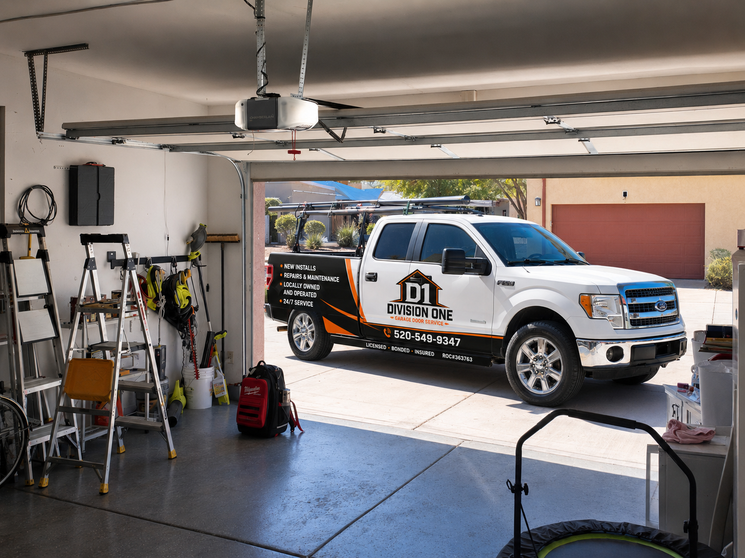 Division One Garage Door Service truck parked in a Tucson driveway